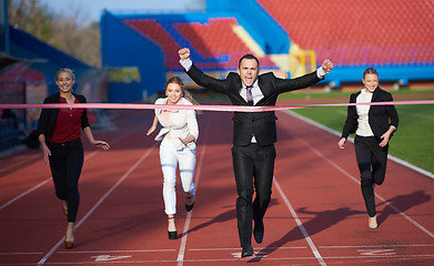 Image showing business people running on racing track