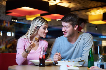 Image showing couple having lunch break in shopping mall