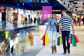 Image showing young couple with shipping bags