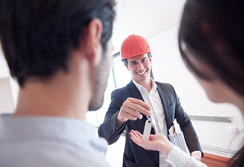 Image showing couple buying new home with real estate agent