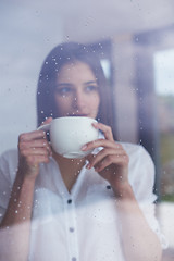 Image showing beautiful young woman drink first morning coffee