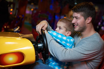 Image showing father and son playing game in playground