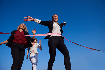 Image showing business people running on racing track