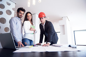 Image showing couple buying new home with real estate agent