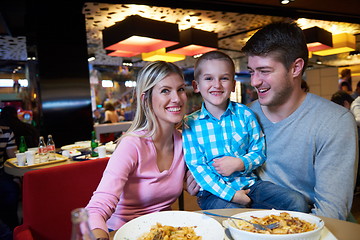 Image showing family having lunch in shopping mall