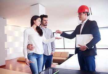 Image showing couple buying new home with real estate agent