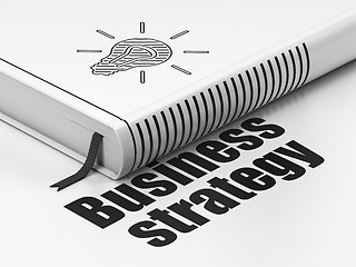 Image showing Business concept: book Light Bulb, Business Strategy on white background