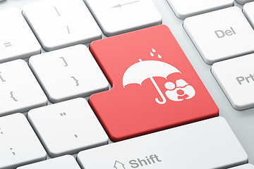 Image showing Protection concept: Family And Umbrella on computer keyboard background