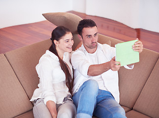 Image showing couple at modern home using tablet computer