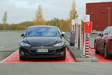 Image showing Tesla Model S Cars Plugged In at Supercharger Station