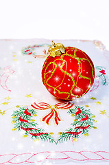 Image showing Red Christmas ball embroidered napkin isolated. Christmas decora