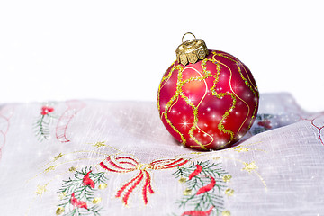 Image showing Red Christmas ball embroidered napkin isolated. Christmas decora