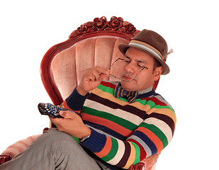 Image showing Closeup of man playing with remote control.