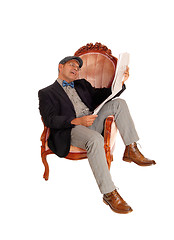 Image showing Hispanic man reading the newspaper.