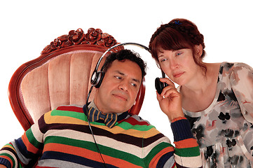 Image showing Husband and wife listening on headphone.