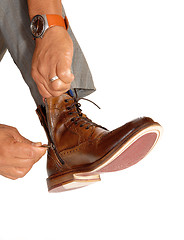 Image showing Man putting on his shoes.