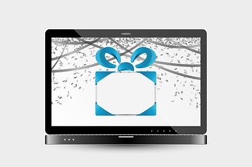 Image showing gift with ribbons and confetti on laptop screen