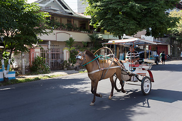 Image showing horse drawn carriage in the streets of Manado