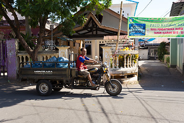 Image showing Man transport water botles in the streets of Manado