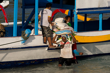 Image showing Men transports cargo from ship