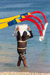 Image showing Men transports cargo from ship