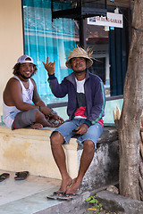 Image showing men resting on street market, Bali