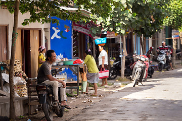 Image showing man resting on street market, Bali