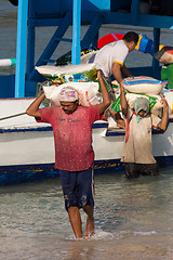 Image showing Men transports cargo from ship