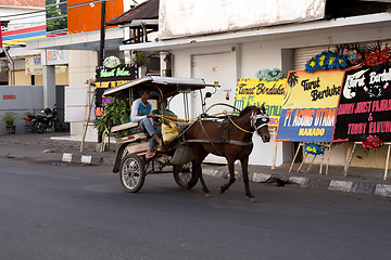 Image showing horse drawn carriage in the streets of Manado