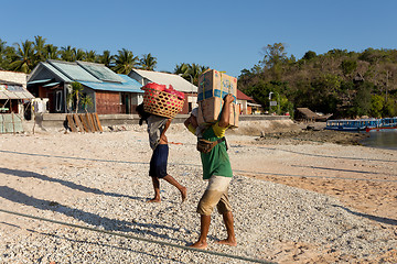 Image showing Men transports cargo from ship