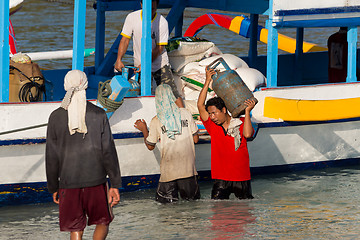 Image showing Men transports cargo from ship