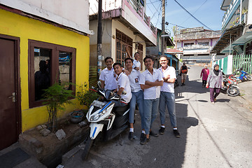 Image showing young happy muslim students in white uniform