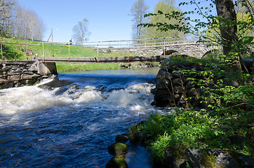 Image showing Rushing water under the bridge