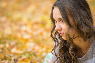 Image showing Close-up portrait of a beautiful young girl looking to the left