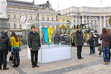 Image showing Burnt Ukrainian flag, which was in the battles in Donbas 