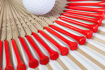 Image showing Typical Japanese hand fan made of bamboo and golf equipments