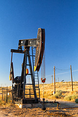 Image showing Working oil pump in desert