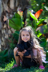 Image showing Little girl with dog