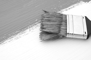 Image showing Close-up of paintbrush painting a board