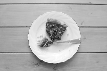 Image showing Half-eaten slice of pecan pie