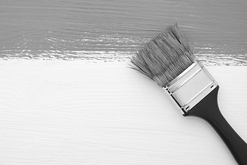 Image showing Stripe of paint with a paintbrush on white