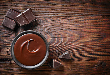 Image showing Chocolate cream and chocolate pieces