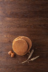 Image showing Waffles with caramel on wood