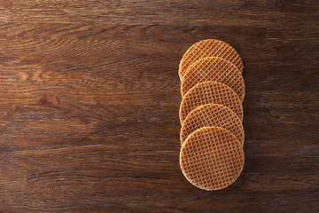 Image showing Waffles with caramel on wood