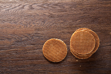 Image showing Waffles with caramel on wood