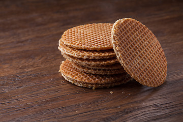 Image showing Waffles with caramel on wood