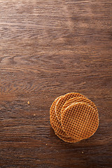 Image showing Waffles with caramel on wood