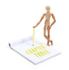Image showing Wooden mannequin writing - Chapter three