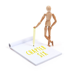 Image showing Wooden mannequin writing - Chapter six