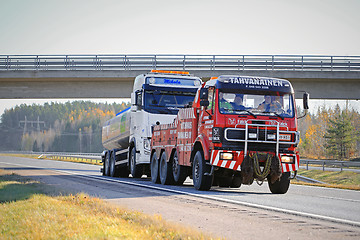 Image showing Tank Truck Being Towed by a Heavy Duty Tow Truck